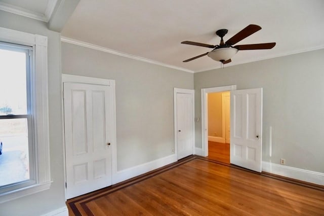 15-1/2 Tremlett St, Boston, MA 02124 - unfurnished bedroom featuring baseboards, wood finished floors, crown molding, and a ceiling fan