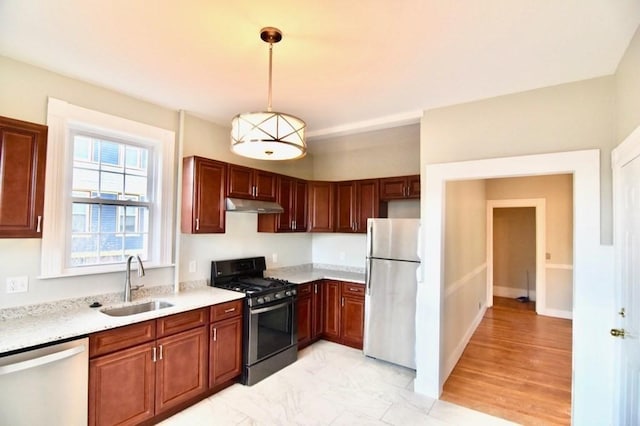 15-1/2 Tremlett St, Boston, MA 02124 - kitchen with appliances with stainless steel finishes, under cabinet range hood, a sink, and pendant lighting