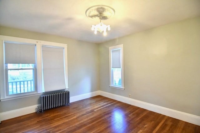 15-1/2 Tremlett St, Boston, MA 02124 - spare room with radiator, a chandelier, and baseboards