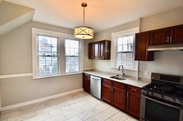 15-1/2 Tremlett St, Boston, MA 02124 - kitchen with stainless steel appliances, under cabinet range hood, a sink, light countertops, and decorative light fixtures