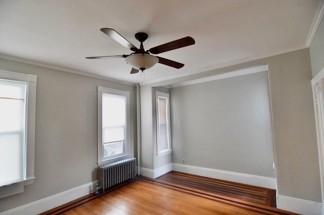 15-1/2 Tremlett St, Boston, MA 02124 - unfurnished room featuring radiator, ceiling fan, light wood-type flooring, baseboards, and crown molding