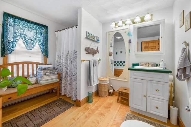 67 Main St, Atkinson, NH 03811 - bathroom featuring vanity, wood finished floors, and a shower with shower curtain