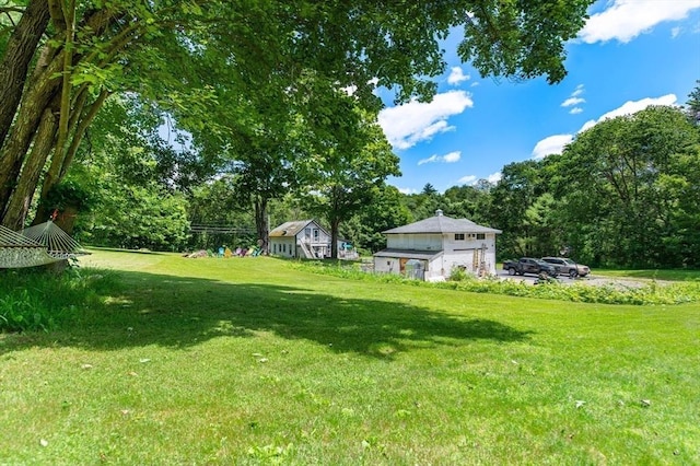 67 Main St, Atkinson, NH 03811 - view of grassy yard featuring view of wooded area