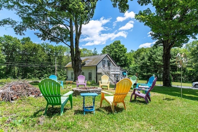 67 Main St, Atkinson, NH 03811 - view of green lawn featuring an outdoor fire pit