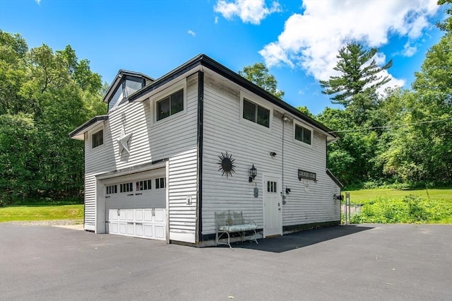 67 Main St, Atkinson, NH 03811 - view of property exterior featuring driveway and an attached garage