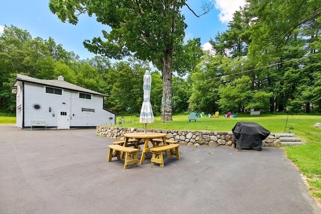 67 Main St, Atkinson, NH 03811 - view of patio / terrace with area for grilling, outdoor dining space, and view of wooded area
