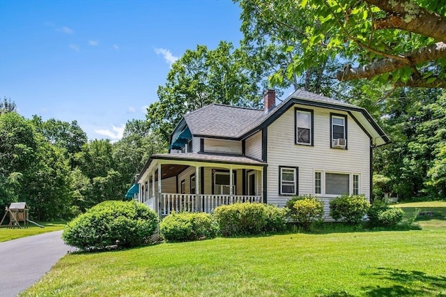 67 Main St, Atkinson, NH 03811 - view of front of property with a front yard, a porch, a chimney, and a shingled roof