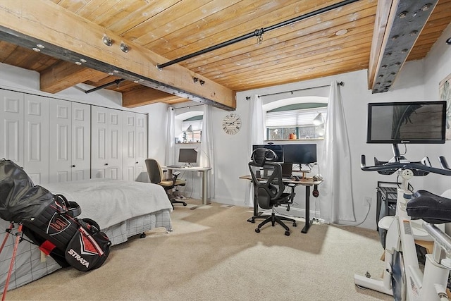 bedroom featuring beamed ceiling, carpet, and wooden ceiling