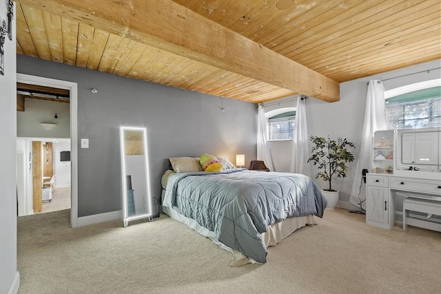 bedroom with wooden ceiling, beam ceiling, and light carpet