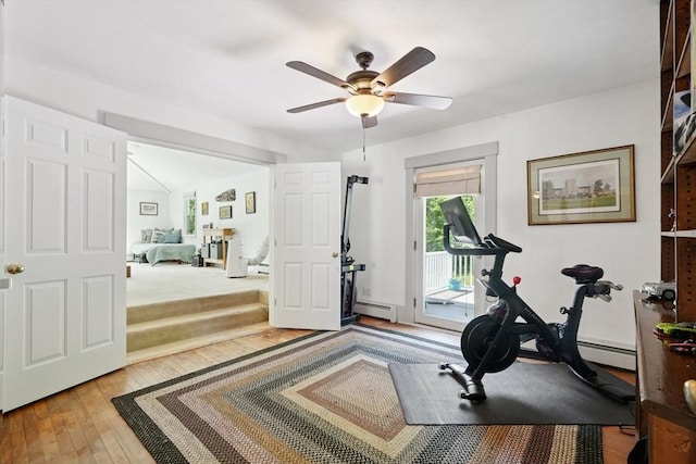 156 Langen Rd, Lancaster, MA 01523 - workout room with a baseboard radiator, ceiling fan, and hardwood / wood-style flooring