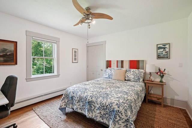 156 Langen Rd, Lancaster, MA 01523 - bedroom with a baseboard radiator, wood finished floors, and ceiling fan