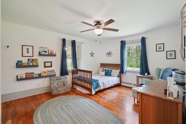156 Langen Rd, Lancaster, MA 01523 - bedroom with baseboard heating, wood finished floors, and a ceiling fan