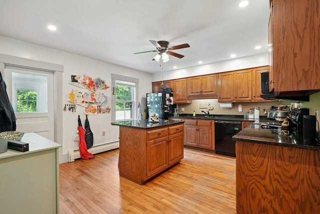 156 Langen Rd, Lancaster, MA 01523 - kitchen featuring black appliances, a baseboard heating unit, ceiling fan, brown cabinets, and a kitchen island