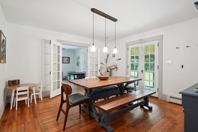 156 Langen Rd, Lancaster, MA 01523 - dining room with french doors, baseboard heating, and hardwood / wood-style floors