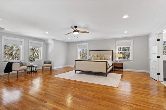 bedroom with recessed lighting, baseboards, and light wood finished floors