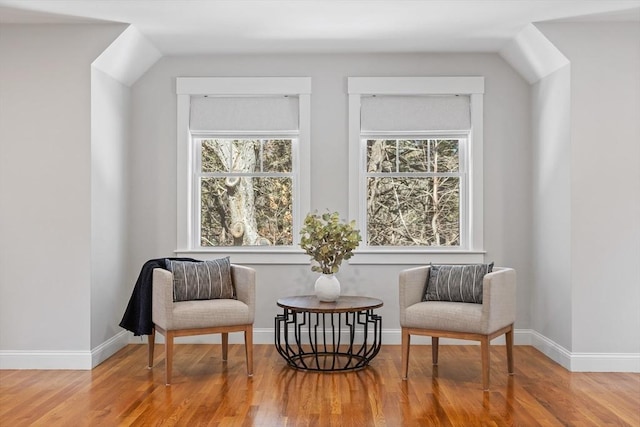 sitting room with wood finished floors and baseboards