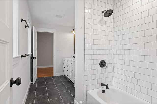 full bath with tile patterned flooring, vanity, bathing tub / shower combination, and baseboards