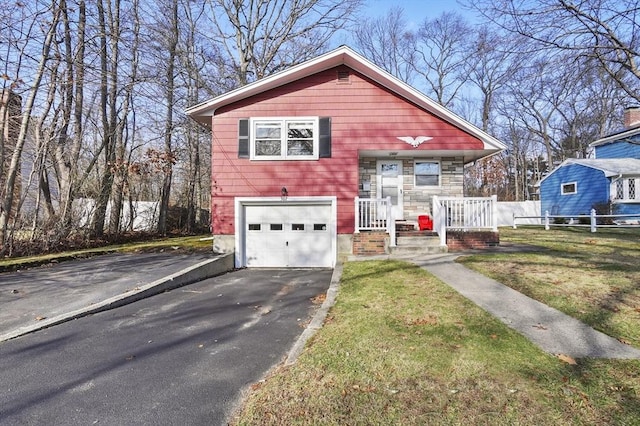 view of front of house featuring a garage and a front yard