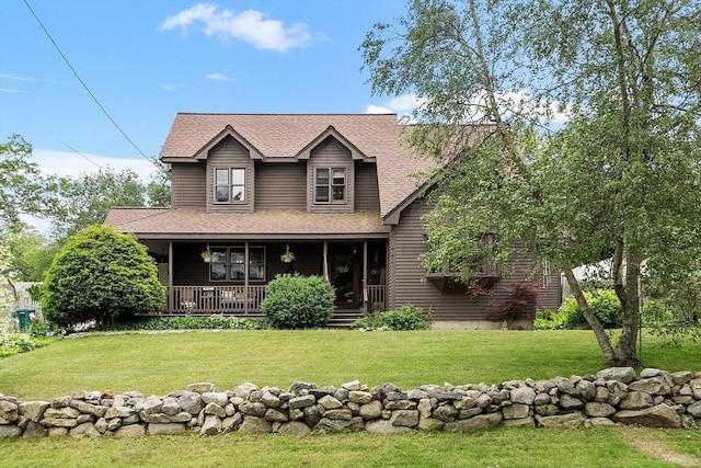 5 Vasa St, Billerica, MA 01862 - view of front of property featuring a front yard, roof with shingles, and covered porch