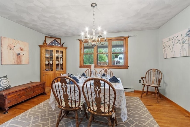 5 Vasa St, Billerica, MA 01862 - dining area featuring a baseboard radiator, a chandelier, and wood finished floors