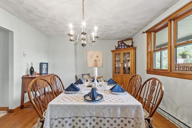 5 Vasa St, Billerica, MA 01862 - dining space featuring baseboard heating, light wood-style floors, and a chandelier