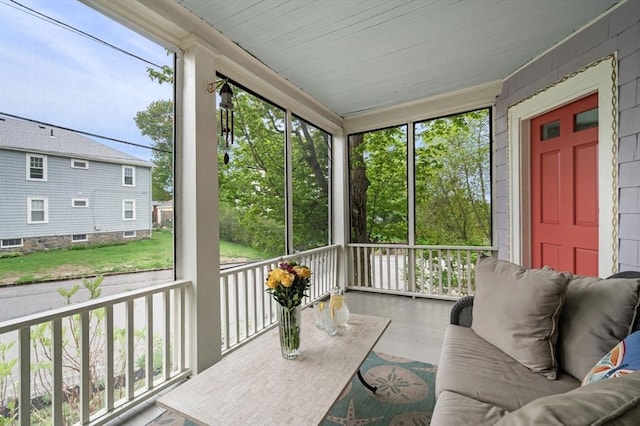 sunroom featuring healthy amount of natural light