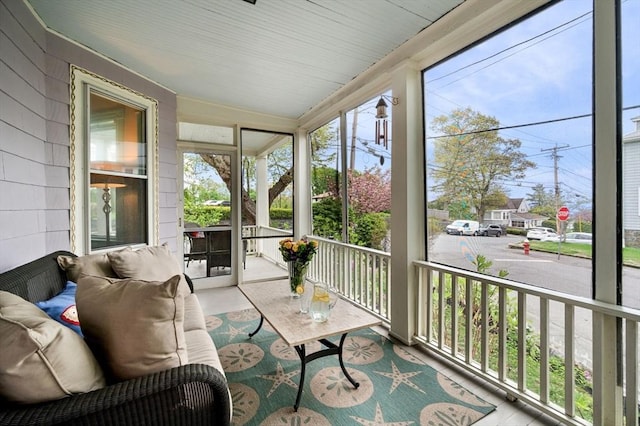 sunroom / solarium with vaulted ceiling