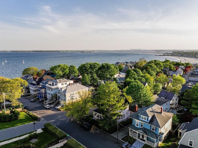 aerial view of residential area with a nearby body of water