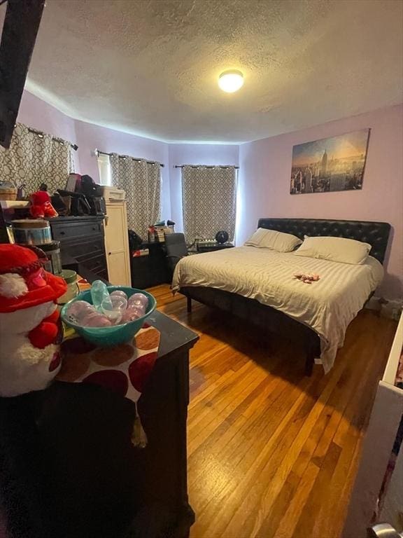 108 Grove St, Lynn, MA 01905 - bedroom featuring light wood finished floors and a textured ceiling