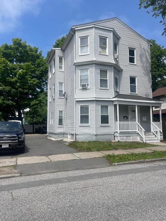 108 Grove St, Lynn, MA 01905 - townhome / multi-family property with covered porch and cooling unit