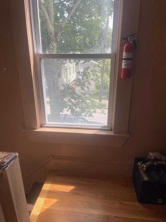 108 Grove St, Lynn, MA 01905 - detailed view of a fire extinguisher and wood finished floors
