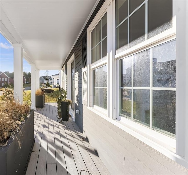 wooden terrace featuring a porch