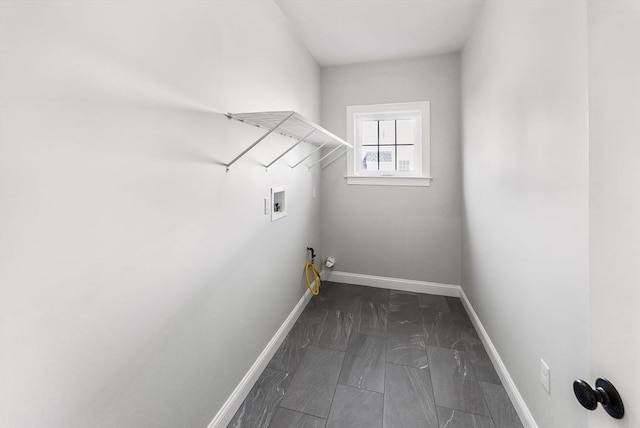 clothes washing area with hookup for a washing machine and hookup for a gas dryer