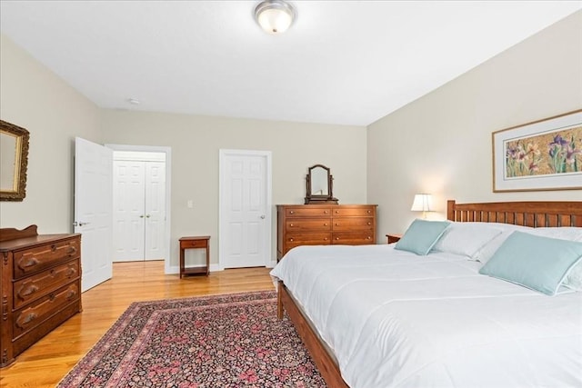 bedroom featuring light wood-style flooring
