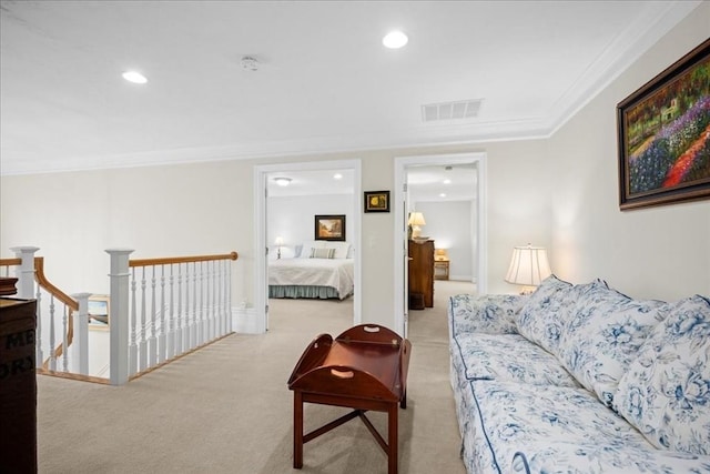 living area featuring light colored carpet, ornamental molding, visible vents, and recessed lighting