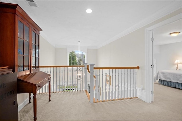 hallway with carpet, visible vents, ornamental molding, and recessed lighting