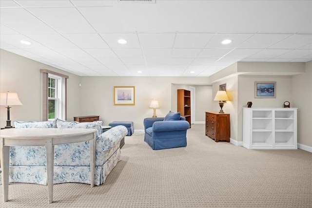 carpeted living area with visible vents, baseboards, and recessed lighting
