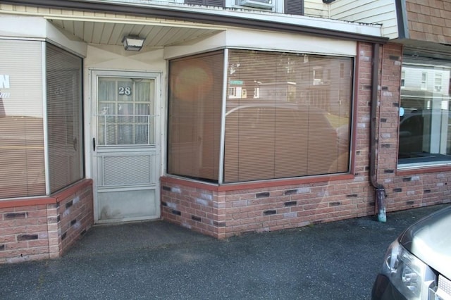 28-30 W Main St, Ware, MA 01082 - property entrance with brick siding