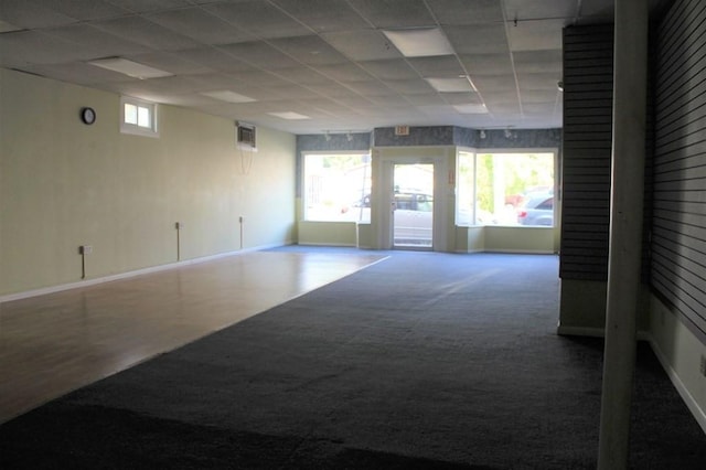 28-30 W Main St, Ware, MA 01082 - carpeted empty room with a paneled ceiling and baseboards