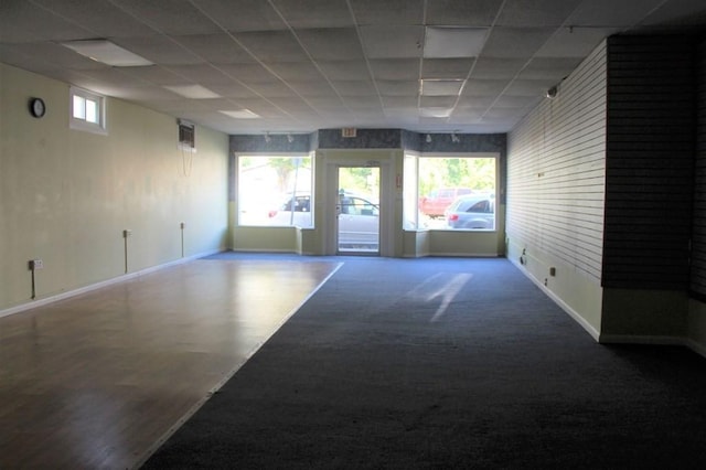 28-30 W Main St, Ware, MA 01082 - carpeted empty room featuring a drop ceiling and baseboards