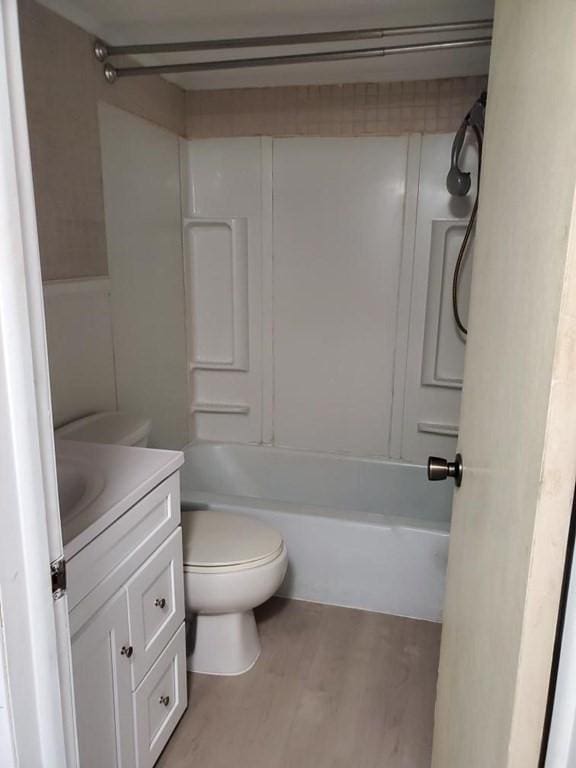 28-30 W Main St, Ware, MA 01082 - bathroom with vanity, wood finished floors, and tub / shower combination