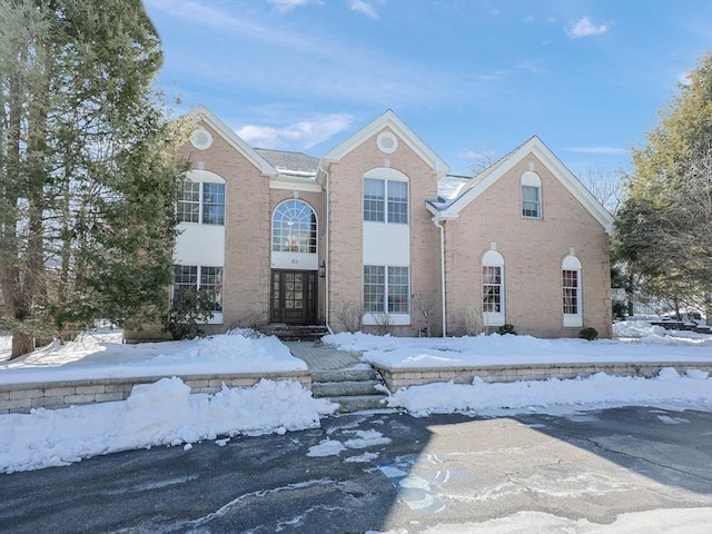 view of front of home featuring brick siding