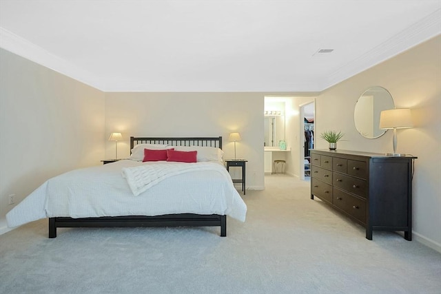 bedroom with light carpet, baseboards, a spacious closet, ornamental molding, and a closet