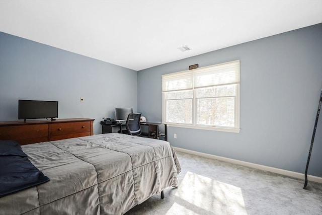 bedroom with carpet floors, visible vents, and baseboards