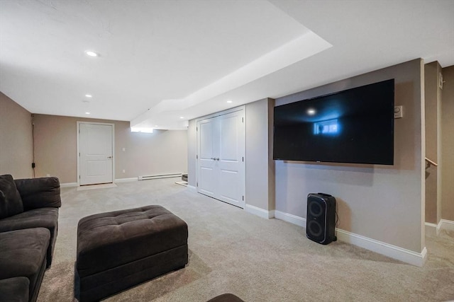 living room with recessed lighting, a baseboard radiator, light colored carpet, and baseboards