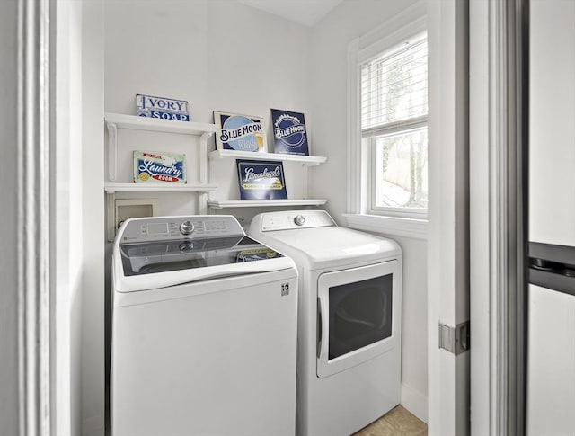 laundry room with separate washer and dryer