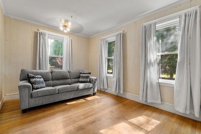 349 Pleasant St, Milton, MA 02186 - living room featuring crown molding, light wood-style flooring, and plenty of natural light