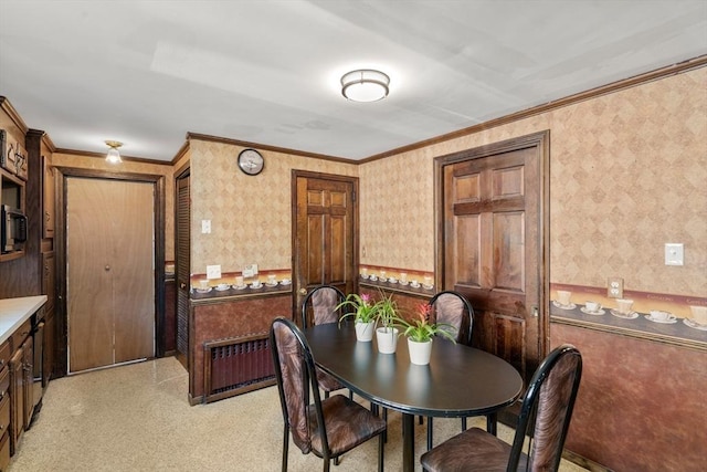 349 Pleasant St, Milton, MA 02186 - dining room featuring wallpapered walls, radiator, and ornamental molding