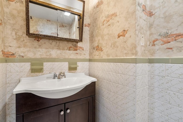 349 Pleasant St, Milton, MA 02186 - bathroom with vanity, a wainscoted wall, and tile walls
