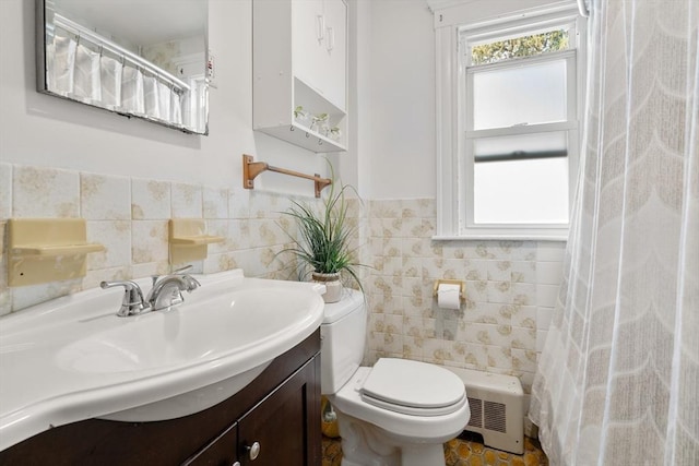 349 Pleasant St, Milton, MA 02186 - bathroom featuring tile walls, vanity, a shower with shower curtain, and wainscoting